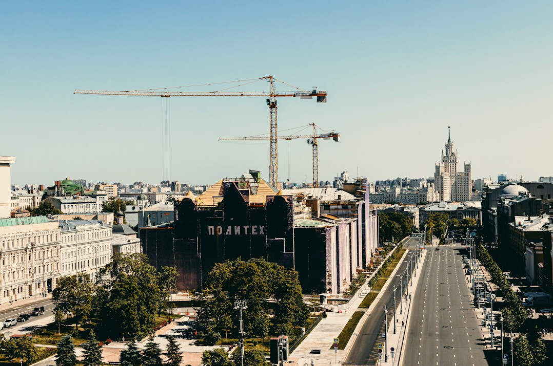 Public construction site with cranes in a city center