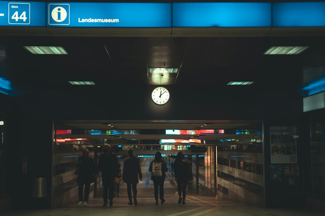 Passengers waiting on a train platform in Switzerland