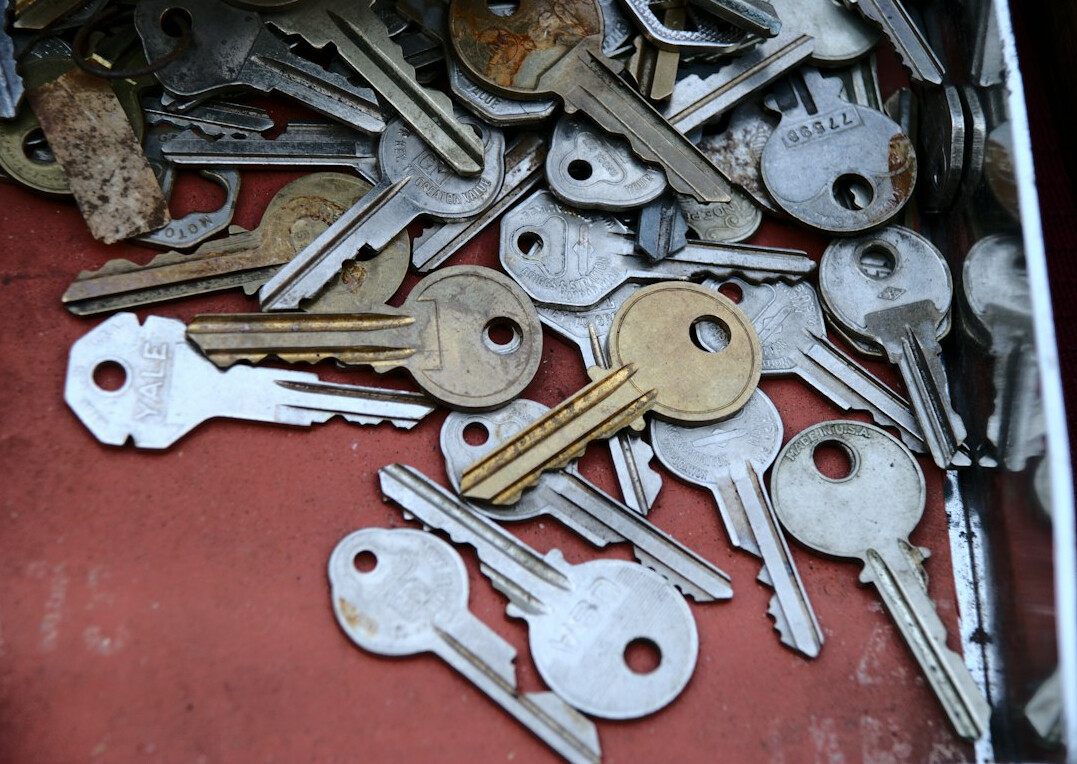 Set of apartment keys resting on a rental contract